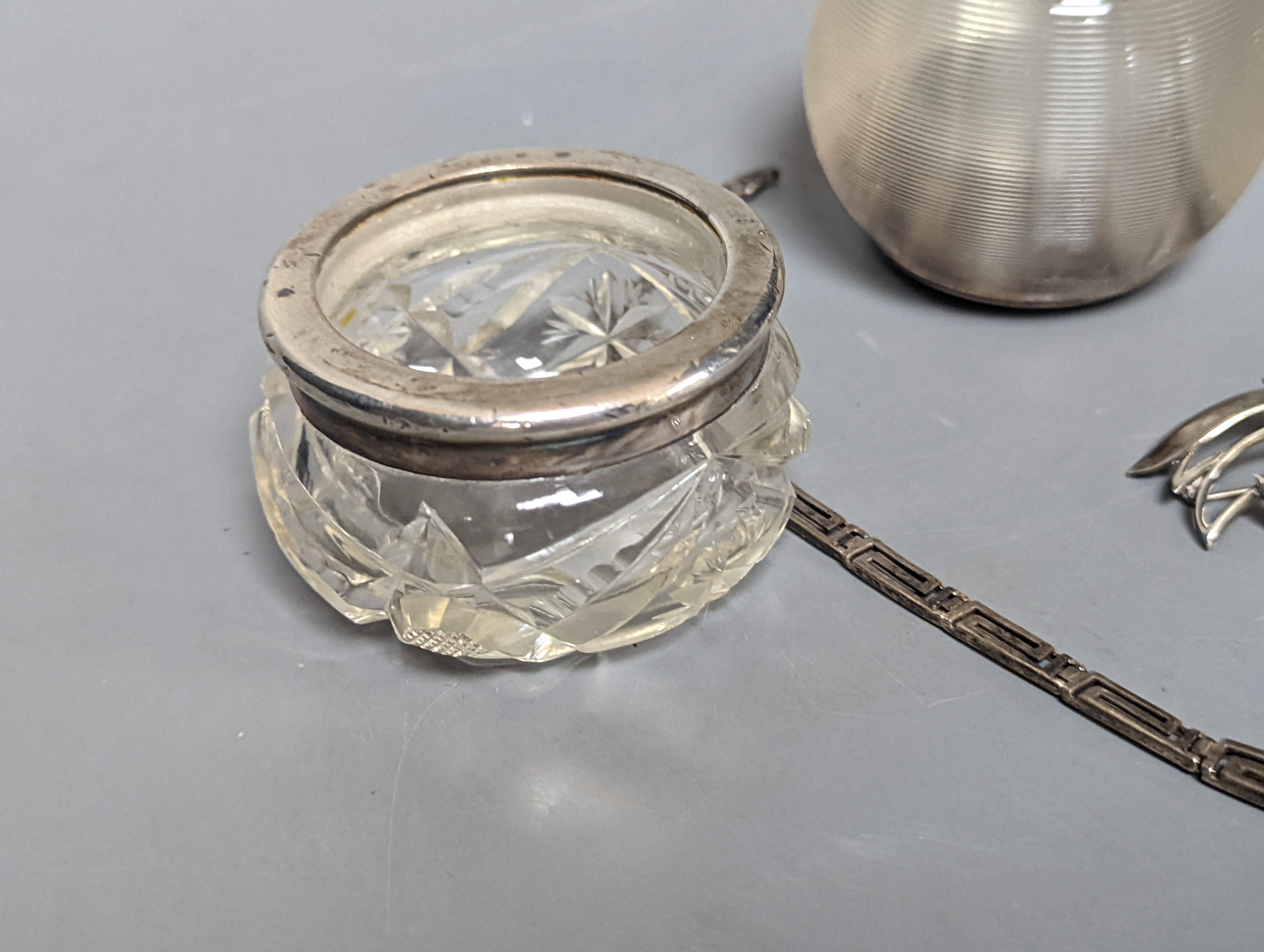 A Danish sterling foliate brooch, 5cm, a 925 'Greek Key' necklace and three silver mounted glass items including an early 20th century match tidy.